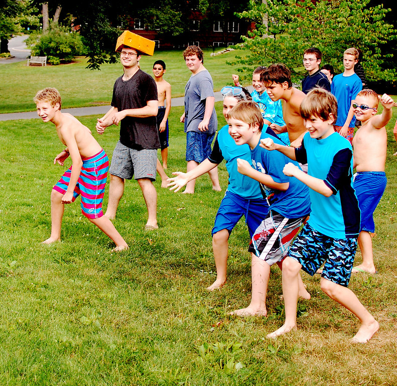 students outside at tech camp playing water games