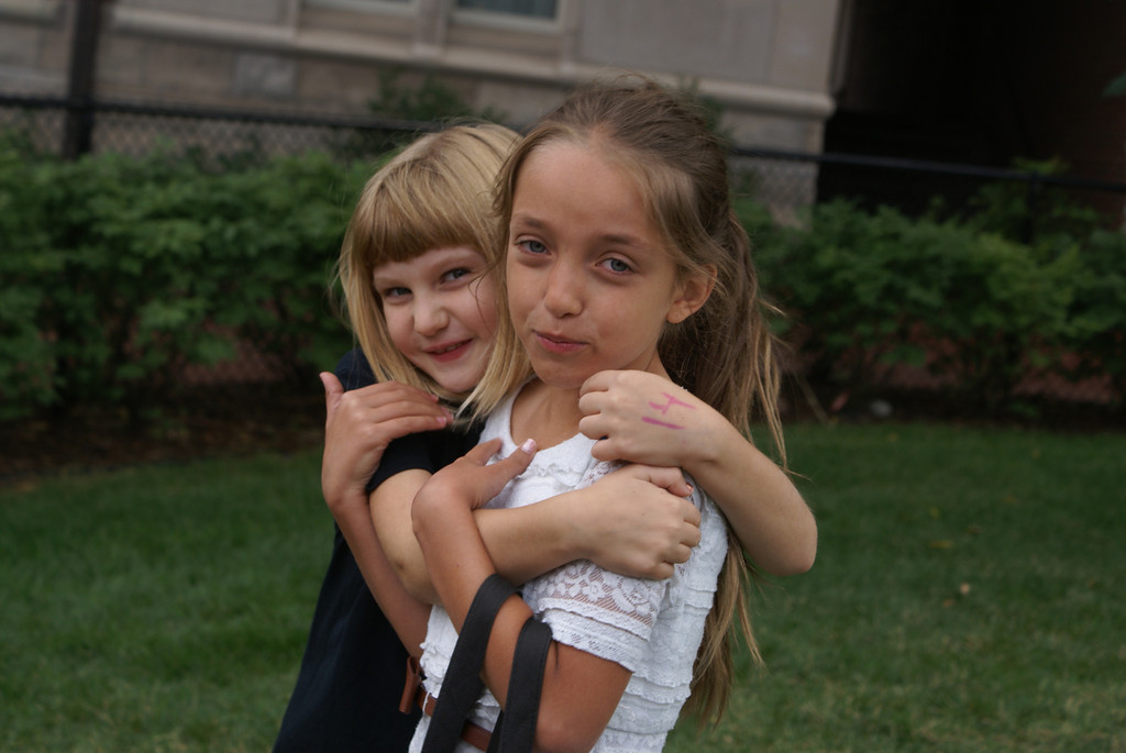 girls hugging and smiling at tech camp
